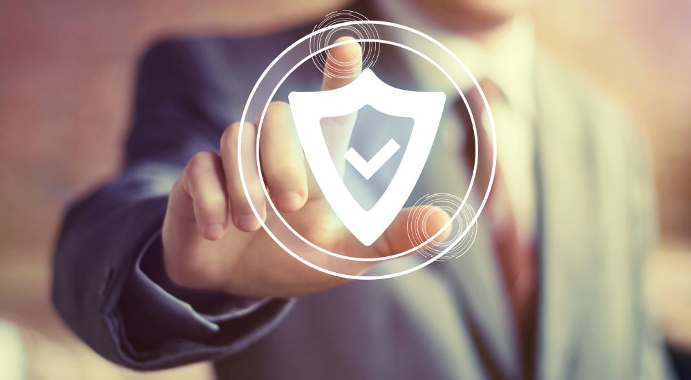 A person is shown touching an anti-theft shield.