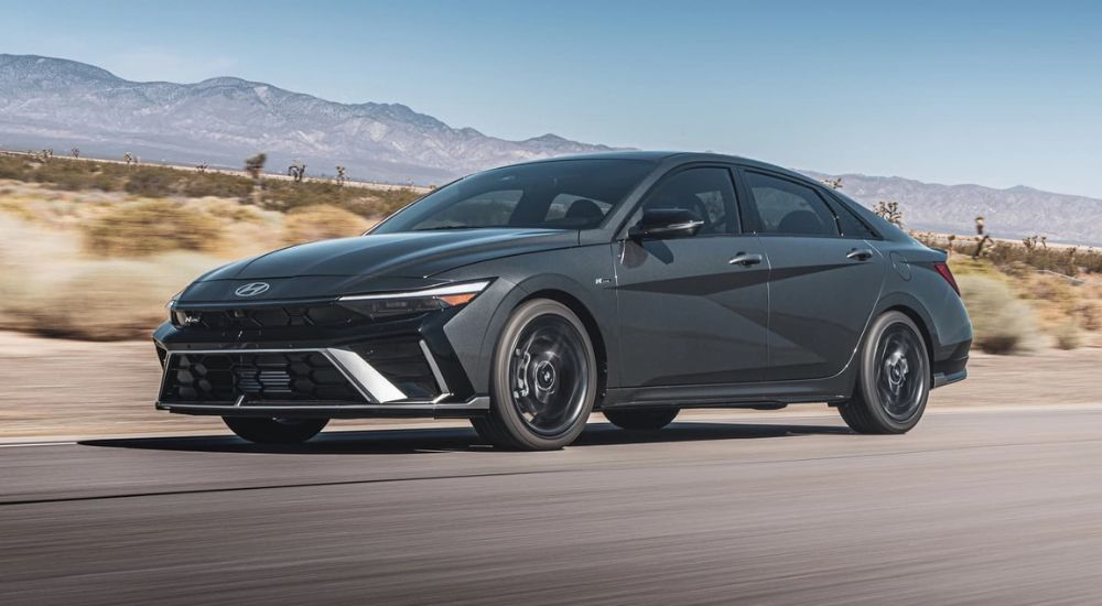 A grey 2024 Hyundai Elantra N-Line is shown from the front at an angle.
