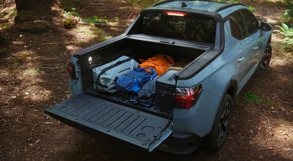 High angle view of the bed of a blue 2022 Hyundai Santa Cruz.